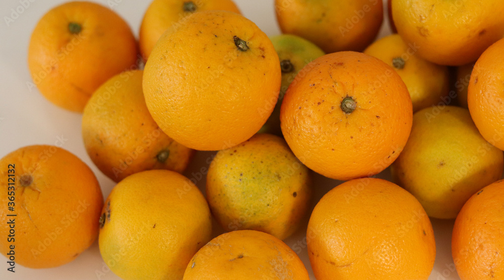 Beautiful oranges arranged on a table. A fruit rich in vitamin c. Beautiful oranges arranged on a table. A fruit rich in vitamin c.