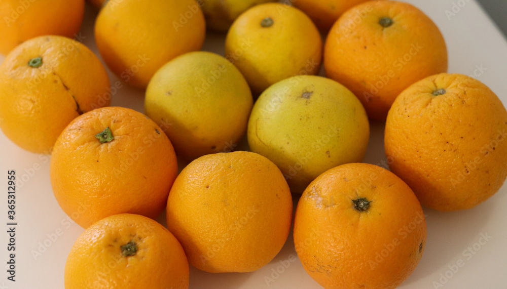 Beautiful oranges arranged on a table. A fruit rich in vitamin c. Beautiful oranges arranged on a table. A fruit rich in vitamin c.