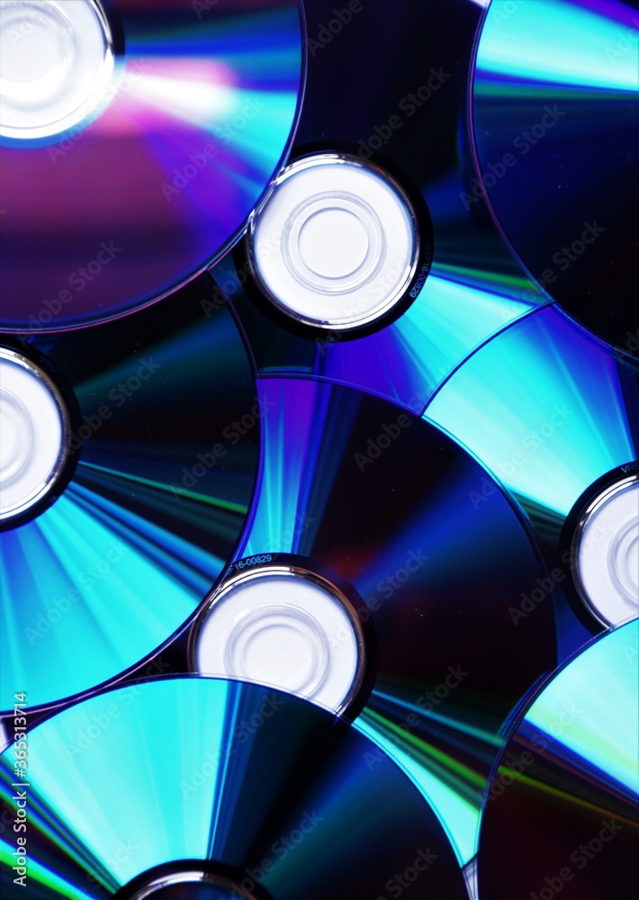 CD DVD Blu-ray discs closeup detail CD DVD Blu-ray discs closeup detail