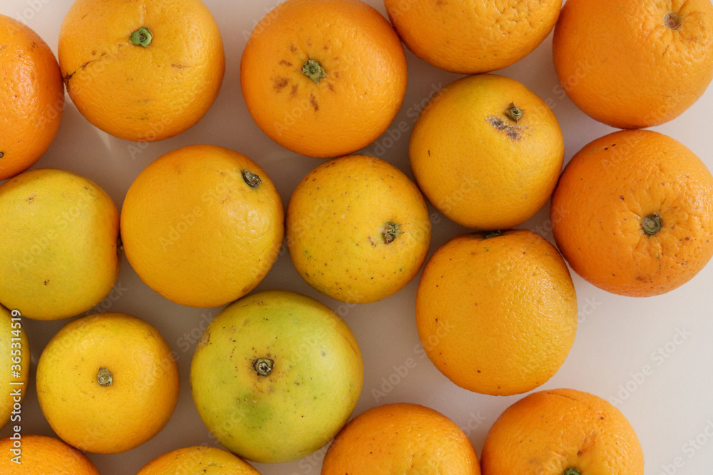 Beautiful oranges arranged on a table. A fruit rich in vitamin c. Beautiful oranges arranged on a table. A fruit rich in vitamin c.