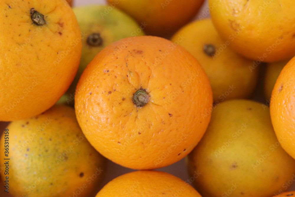 Beautiful oranges arranged on a table. A fruit rich in vitamin c. Beautiful oranges arranged on a table. A fruit rich in vitamin c.