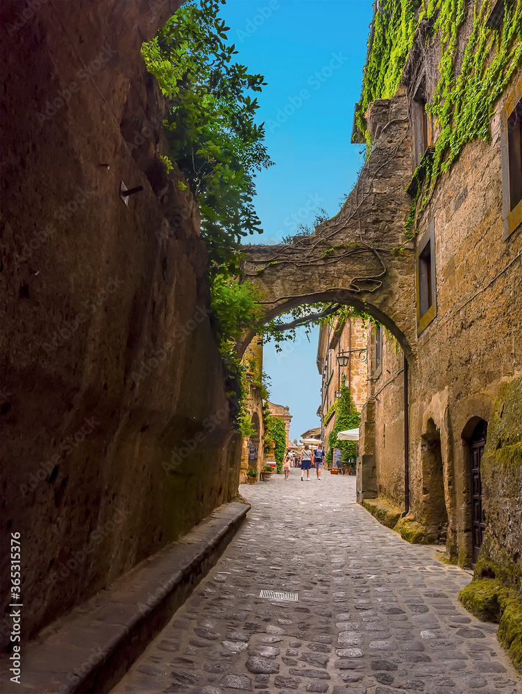 A view along the entrance corridor into the settlement of Civita di Bagnoregio in Lazio, Italy in summer