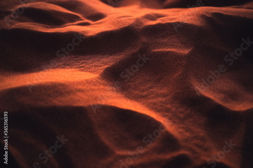 Rippled glowing sand of desert at sunset © Mumemories