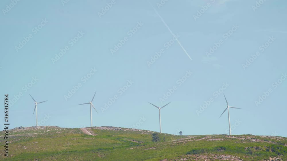 mountains with windmills and blue sky mountains with windmills and blue sky