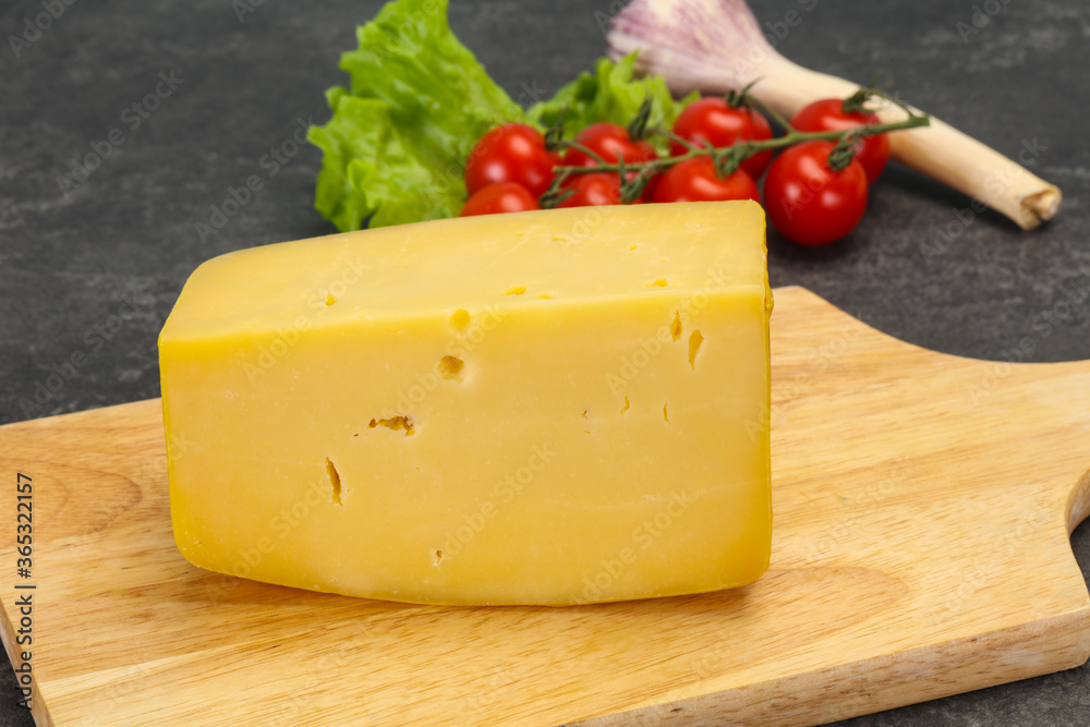 Hard yellow tasty cheese brick Hard yellow tasty cheese brick