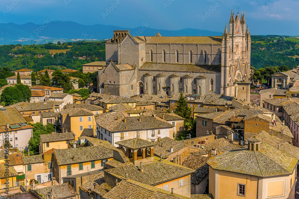 The cathedral dominates the skyline in Orvieto, Italy in summer