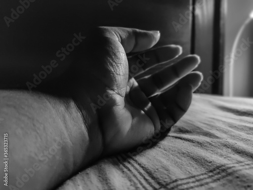 Isolated image of hand or palm of man in dark. © tanmoythebong