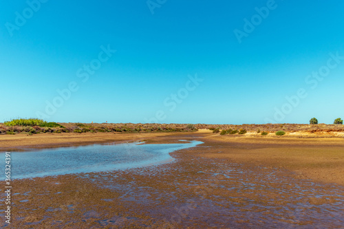 Small lake in the dunes next to the beach in Alvor in Portim  o - Portugal