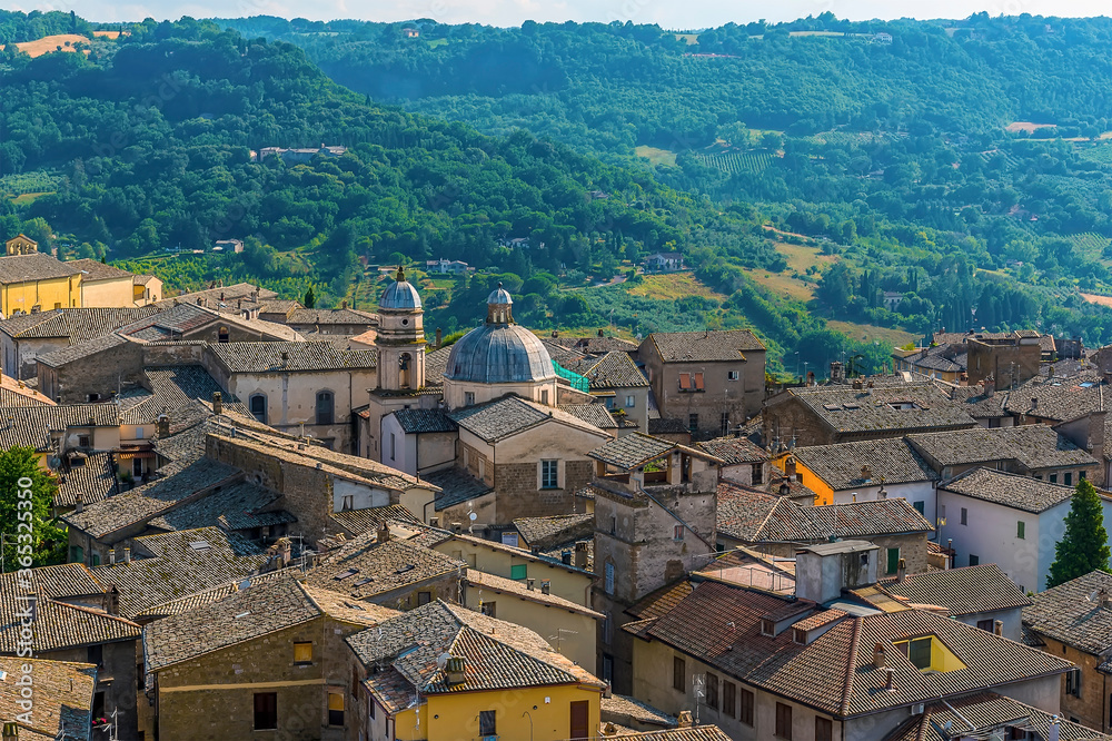 Domed churches and roof tops in Orvieto, Italy in summer
