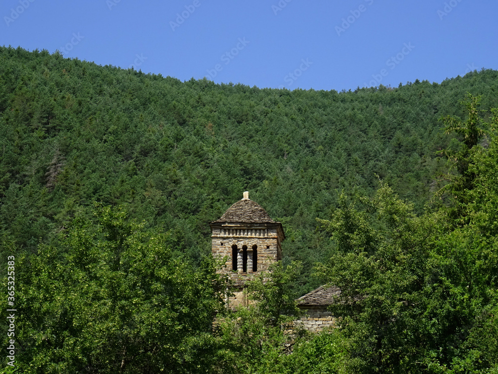 Landscape with the bell tower of the Mozarab Pre-Romanesque or Romanesque Church of San Bartolome de Gavín in the Serrablo Region. 10th-11th century. Aragon. Spain. 