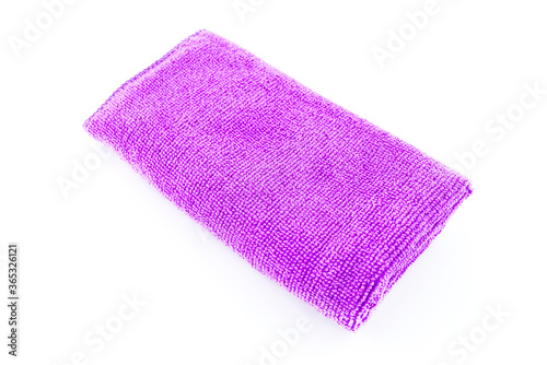 Purple microfiber fabric lying in the middle, isolated on a white background, top view.