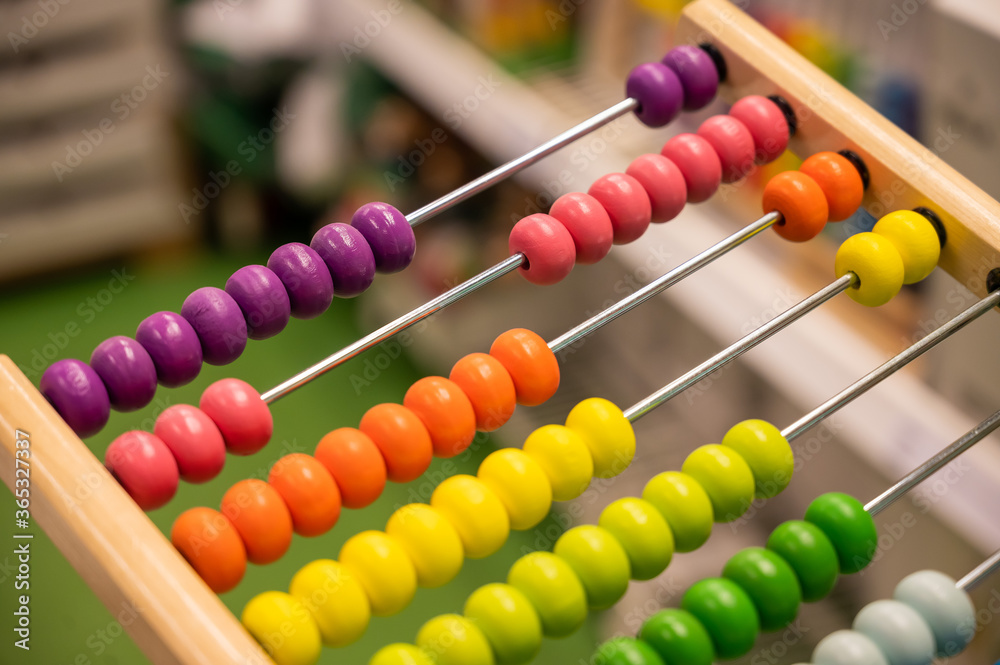 Bright colored hand abacus. Children's wooden toy for the study of arithmetic. Bright colored hand abacus. Children's wooden toy for the study of arithmetic.