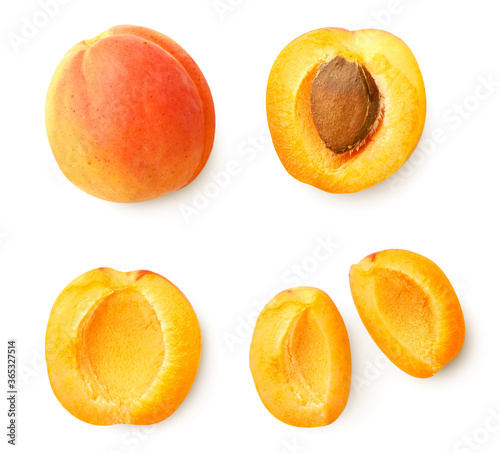 Set of ripe apricot, two halves and slices on a white. Top view.