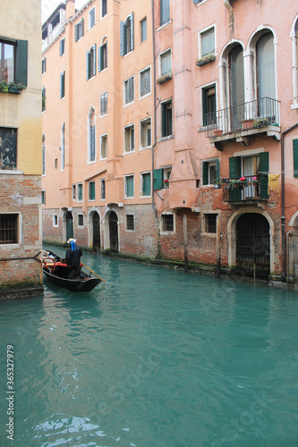 gondola in a turquoise canal in winter venice italy © Candace