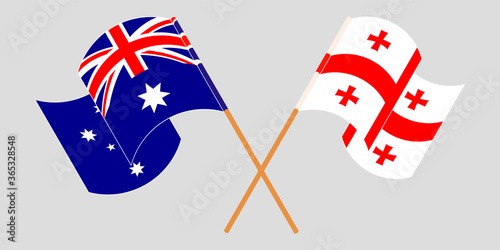 Crossed and waving flags of Georgia and Australia