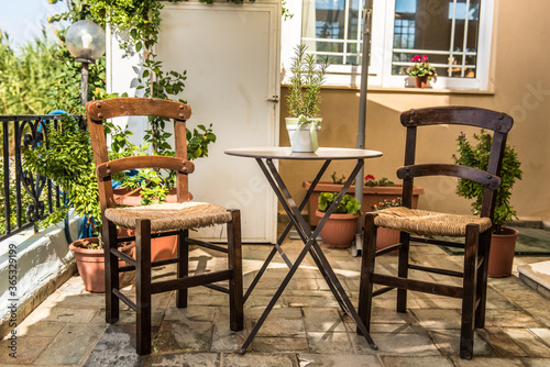 Typical kafenion set, table and traditional greek chairs.