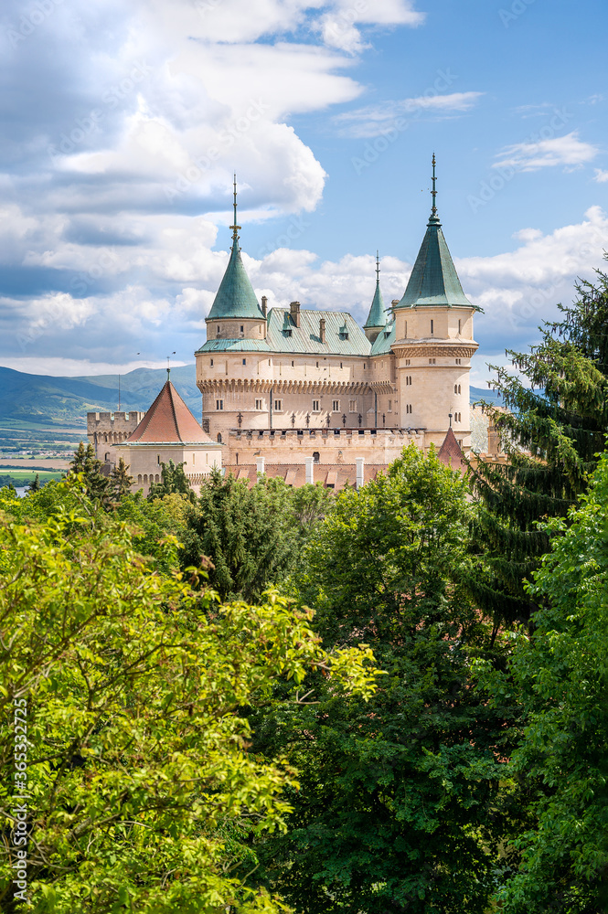 View of neogothic Bojnice castle over treetops of Castle park (Bojnice, Slovakia)