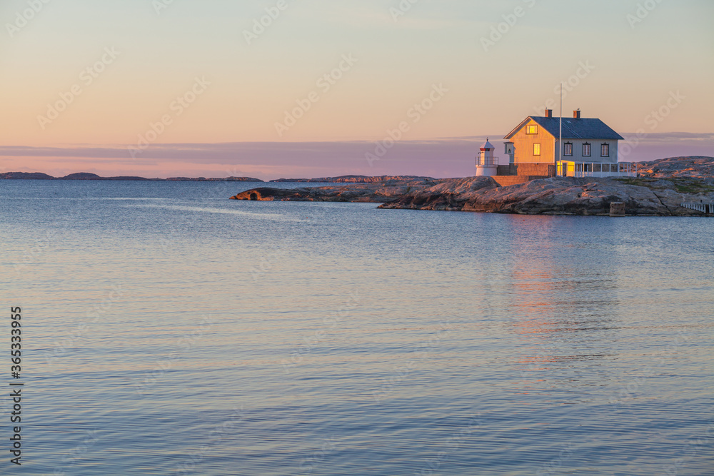 A beautiful sunset over the sea and a lighthouse  on the the Swedish west coast, Sweden 