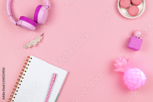 Wallpaper Mural Modern female working space, top view. Women's or girls things, wireless headphones, lamp, perfume, stationery on pink background, copy space, flat lay. Work from home concept. For blog. Horizontal Torontodigital.ca