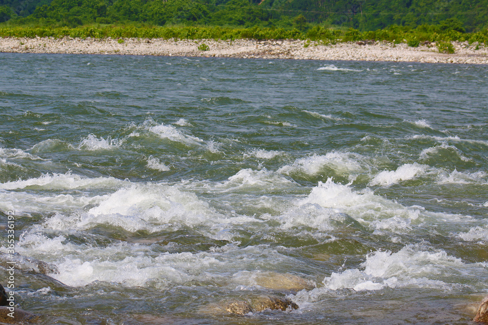 Fototapeta premium Wide Mountain River Cuts a Valley