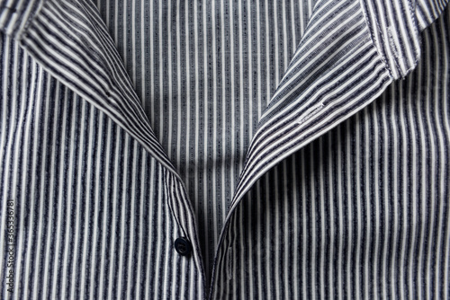 Close up of men's striped shirt. Front view. 