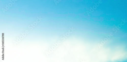 Beautiful blue sky and white clouds of various shapes with sunlight. Nature background