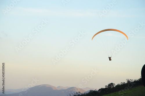 Paragliding at sun set in Topo do Mundo (translated to Top of the World) in Minas Gerais