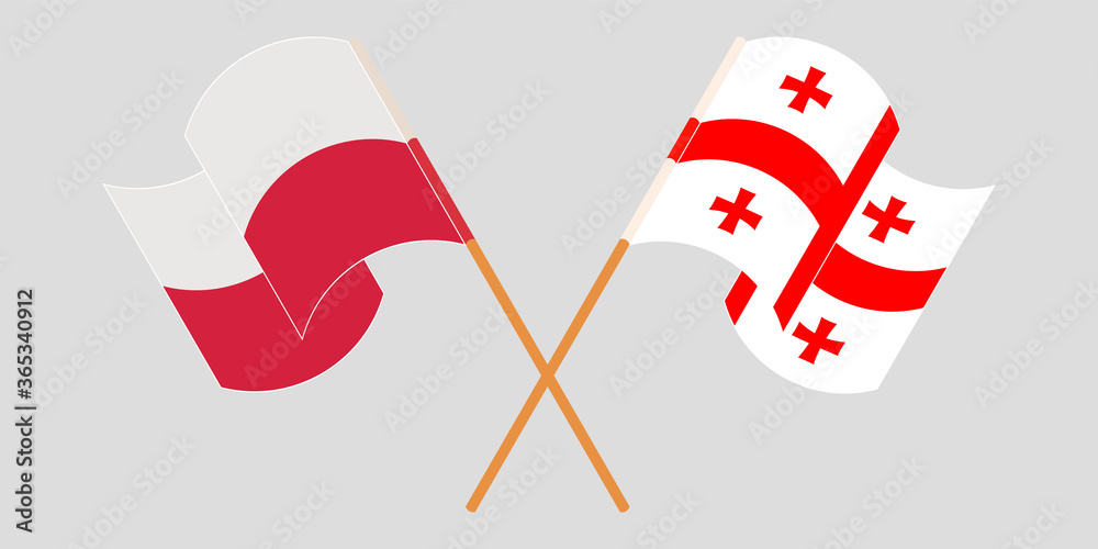 Crossed and waving flags of Georgia and Poland Crossed and waving flags of Georgia and Poland
