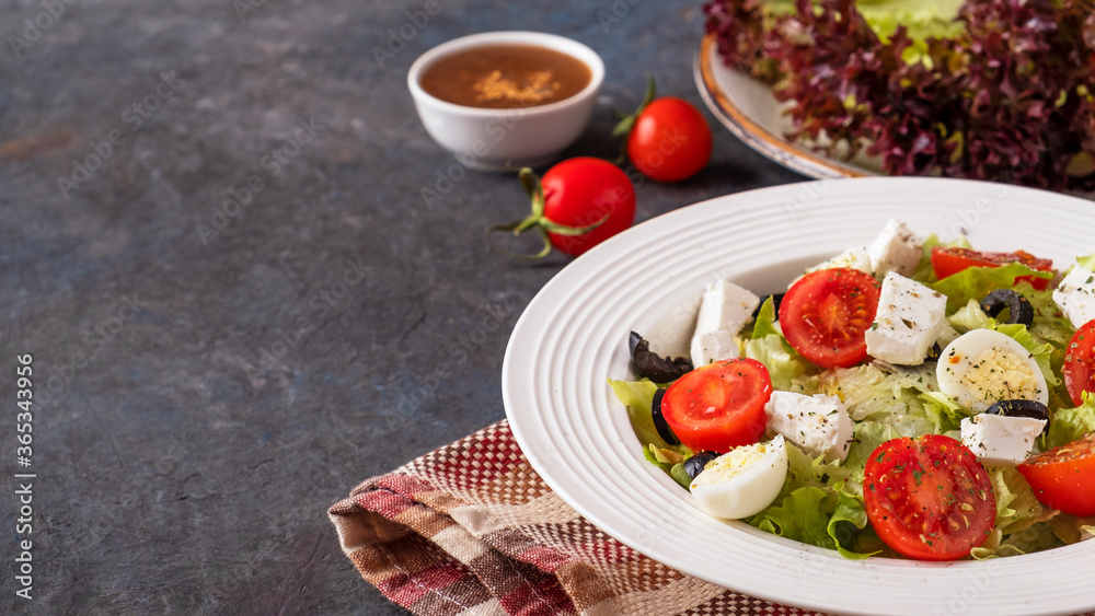 Fresh vegetables salad on a plate. Healthy and diet food concept. Copy space.