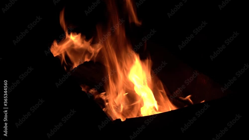 Camping fire in total darkness during night and nobody around Camping fire in total darkness during night and nobody around
