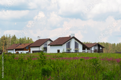 image of residential houses in the field