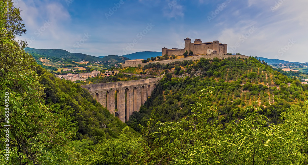 The Tower Bridge spans the gorge leading to the hill top fortress in Spoleto, Italy in summer