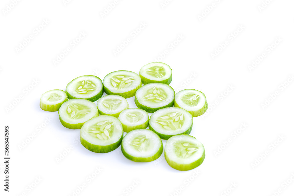 slices of fresh green cucumber. isolated white background. copyspace slices of fresh green cucumber. isolated white background. copyspace