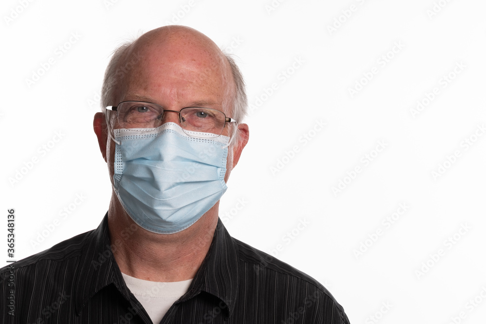Headshot of male teacher wearing Covid 19 mask isolated on white background with room for copy to the right Headshot of male teacher wearing Covid 19 mask isolated on white background with room for copy to the right