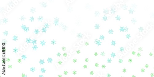 Light green vector doodle texture with flowers.