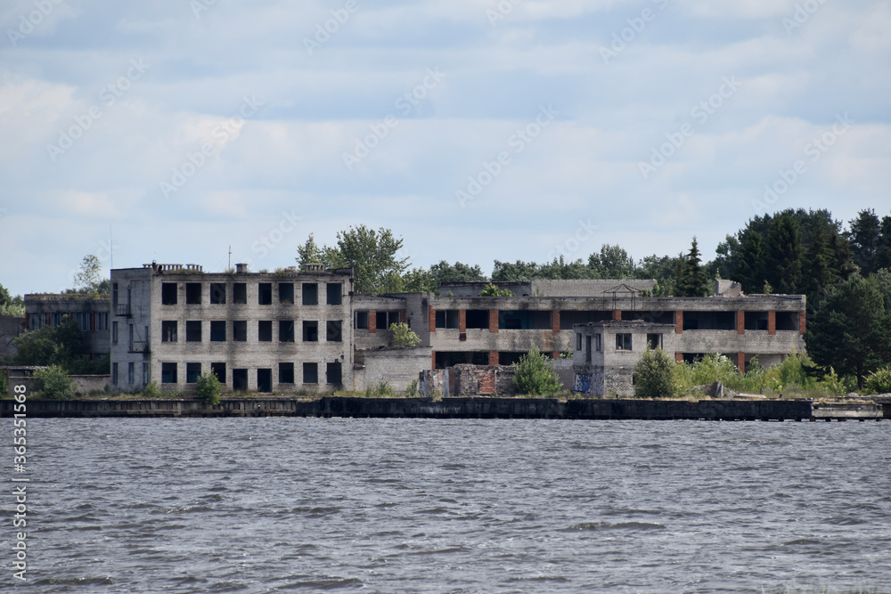 Abandoned buildings complex on the shore.