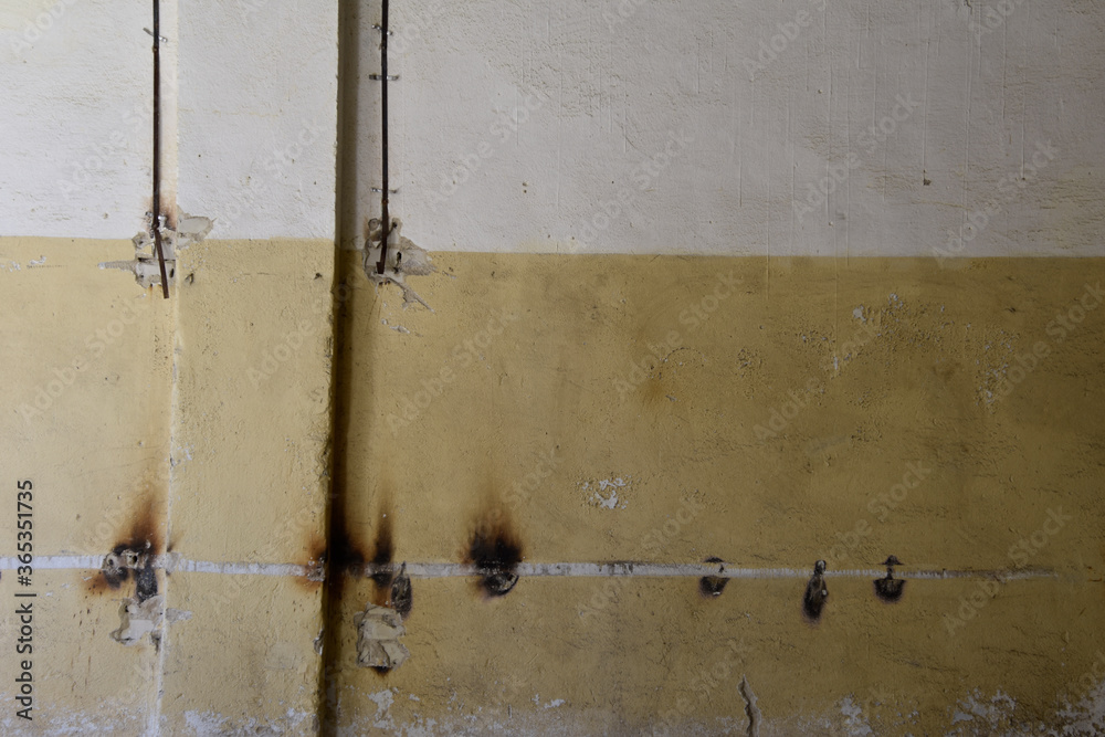 Old wall in abandoned building with burn marks. 