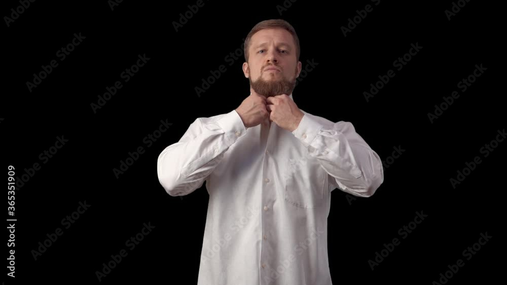man straightens his shirt. Caucasian admire themselves. A man with a beard puts on a shirt. High quality 4k footage man straightens his shirt. Caucasian admire themselves. A man with a beard puts on a shirt. High quality 4k footage