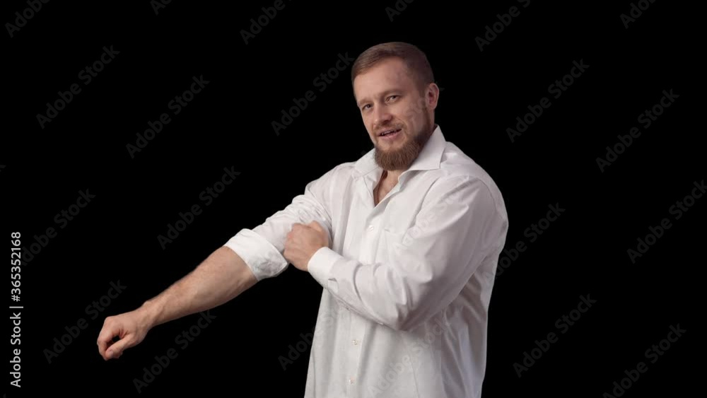 A man puts on a shirt. Caucasian buttons buttons of clothing. Dressed up. High quality 4k footage A man puts on a shirt. Caucasian buttons buttons of clothing. Dressed up. High quality 4k footage