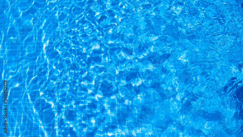 water ripples in a swimming pool in summer