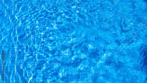 water ripples in a swimming pool in summer