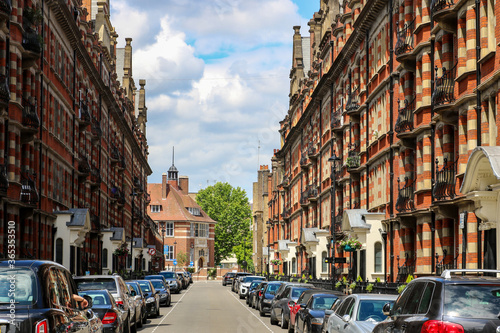 London Streets.  A view down Glentworth Street, Marylebone, London NW1 towards Ivor Place. The stunning Edwardian red brick mansion blocks have wrought iron Art Nouveau balconies. © Hanging Bear Media
