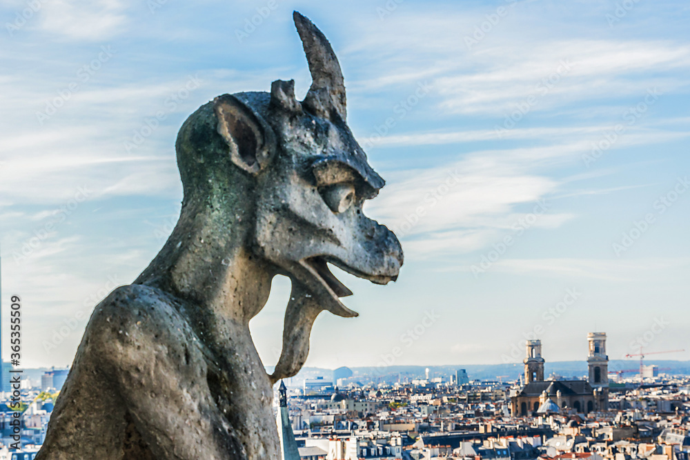 Famous Stone demons gargoyle and chimera on Notre Dame de Paris. View from top of Notre Dame de Paris. France. 
