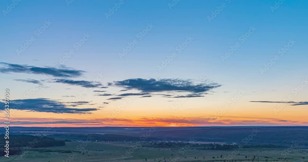 Beautiful evening sunset, time lapse, movement of clouds of a different level against the setting sun. Sun rays shine through the clouds, time lapse 4k. Beautiful evening sunset, time lapse, movement of clouds of a different level against the setting sun. Sun rays shine through the clouds, time lapse 4k.