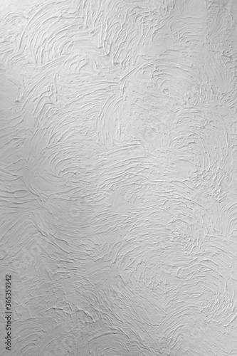 Seamless white textured wall background with subtle shadows.