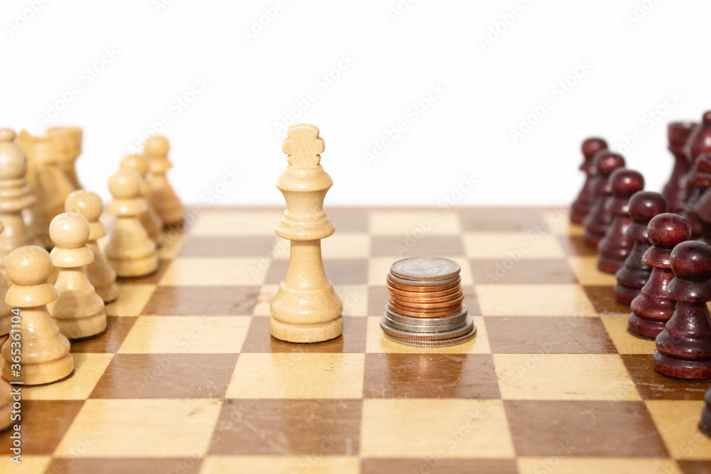 Game Piece King and Coins Money Chess Background Strategic Savings and Investment Concept to Represent Financial Planning Game Piece King and Coins Money Chess Background Strategic Savings and Investment Concept to Represent Financial Planning