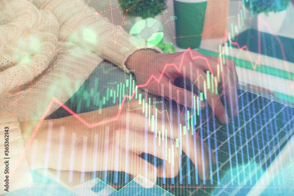 Double exposure of woman hands typing on computer and forex chart hologram drawing. Stock market invest concept.