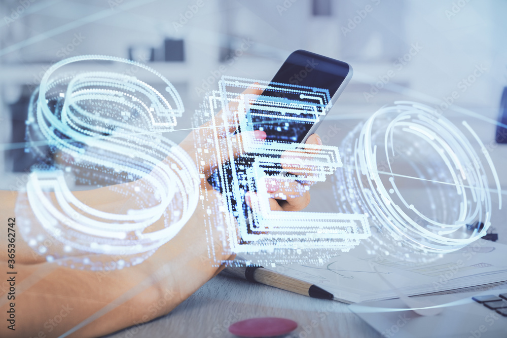 Multi exposure of man's hands holding and using a digital device and seo drawing. search optimization concept. Multi exposure of man's hands holding and using a digital device and seo drawing. search optimization concept.
