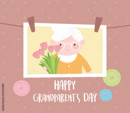 happy grandparents day, hanging photo with granny holding flowers cartoon card