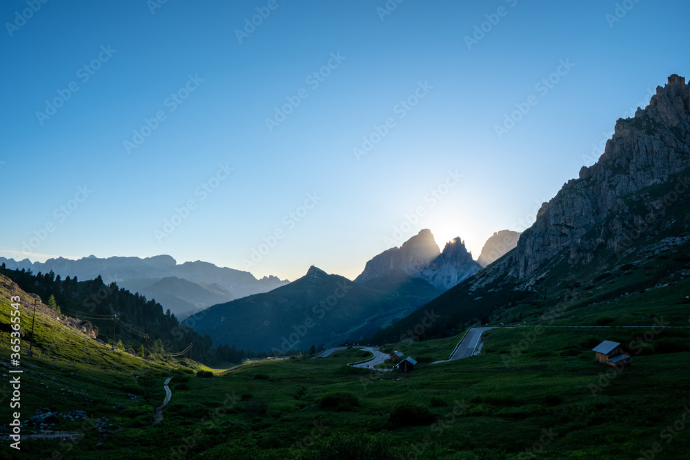 Evening view of the Pordoi Pass in the Italian Dolomites at sunset.
